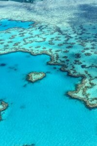 Stunning aerial photograph of the heart-shaped Great Barrier Reef in the Whitsundays, Australia.