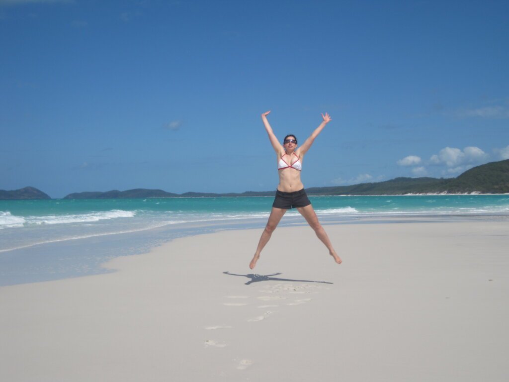 Whitsunday_Island_Beach Whitehaven Beach Woman Jumping